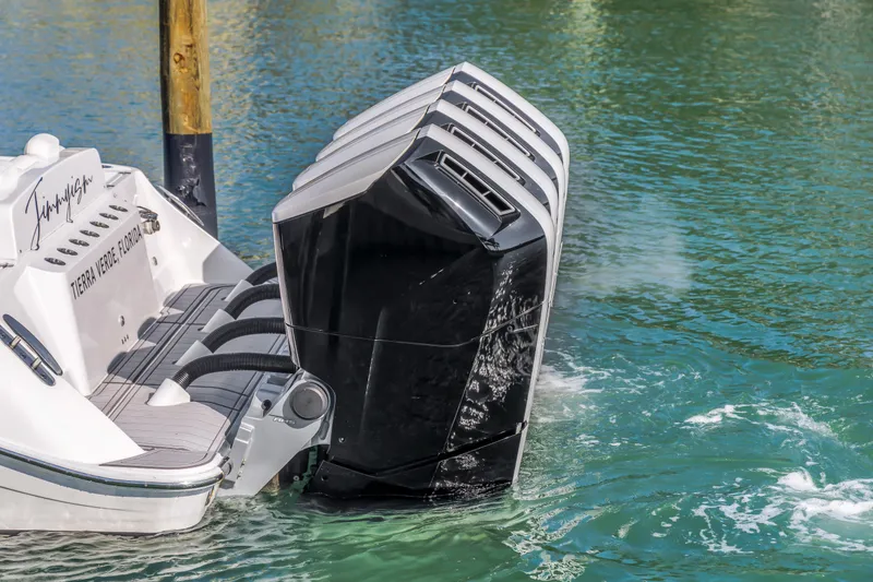 Slide: The Image of 2023 HCB 53 Suenos RXV boat with multiple outboard engines in water. - 29