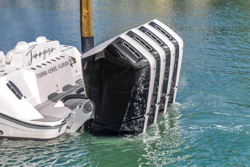 Slide: The Image of 2023 HCB 53 Suenos RXV boat with four powerful outboard engines in water. - 31