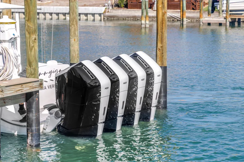 Slide: The Image of 2023 HCB 53 Suenos RXV with four powerful outboard engines docked in marina. - 32