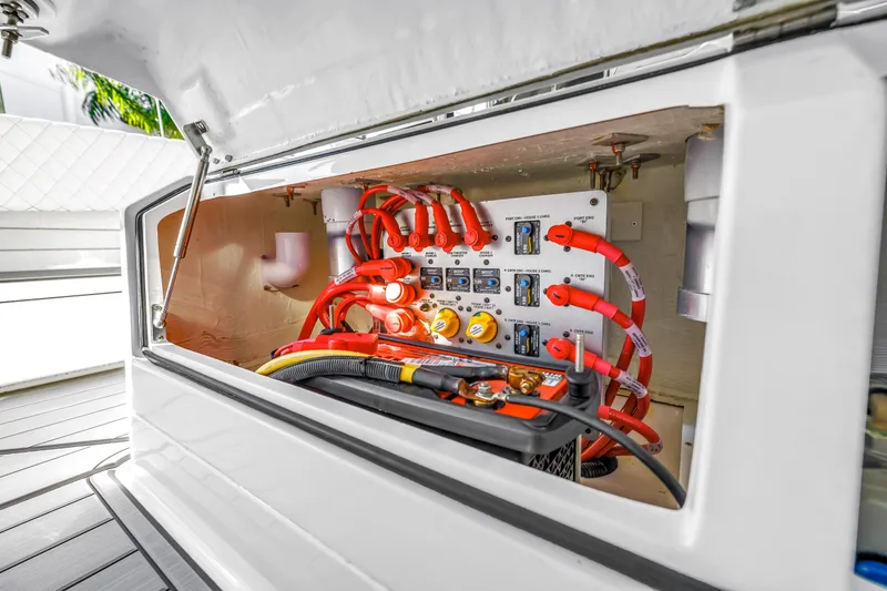 Slide: The Image of Electrical panel of 2023 HCB 53 Suenos RXV boat with red cables and connectors. - 37