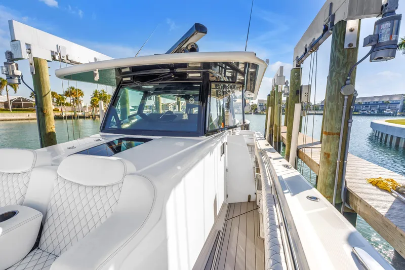 Slide: The Image of 2023 HCB 53 Suenos RXV luxury boat docked in a sunny marina. - 38