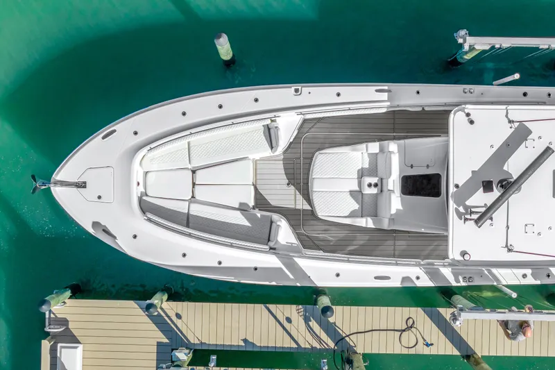 Slide: The Image of Aerial view of 2023 HCB 53 Suenos RXV yacht docked in turquoise water. - 5