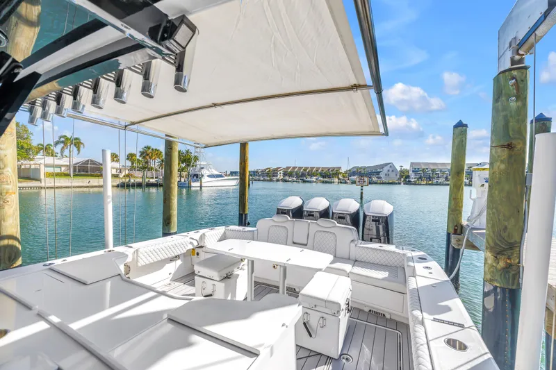 Slide: The Image of 2023 HCB 53 Suenos RXV luxury boat docked in a sunny marina setting. - 51