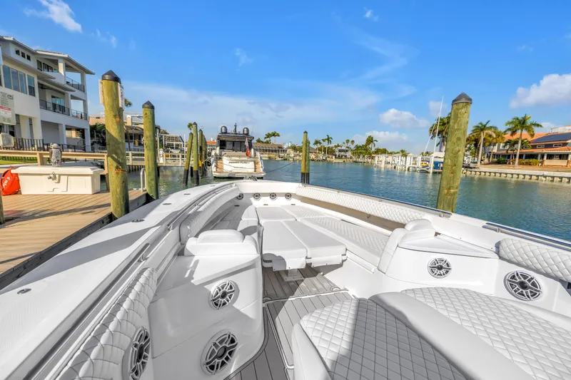 Slide: The Image of 2023 HCB 53 Suenos RXV luxury boat docked in sunny marina. - 61