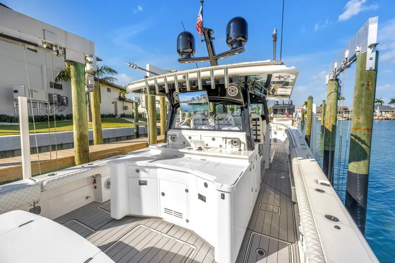 Slide: The Image of 2023 HCB 53 Suenos RXV luxury boat docked, showcasing sleek design and modern amenities. - 66