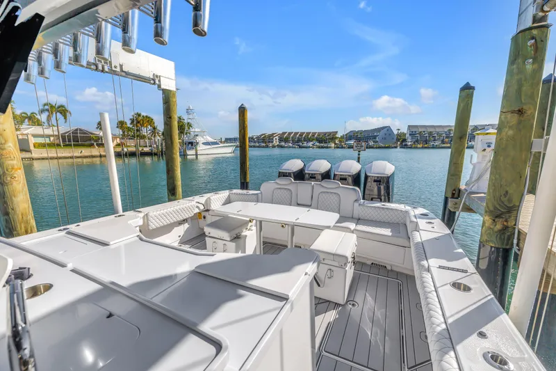 Slide: The Image of 2023 HCB 53 Suenos RXV luxury boat docked in a scenic marina. - 76