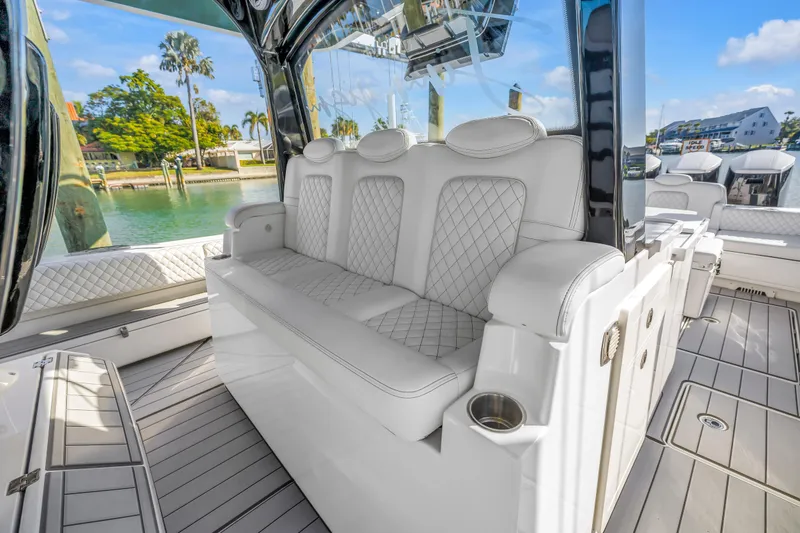 Slide: The Image of Luxurious seating on 2023 HCB 53 Suenos RXV boat, featuring elegant white upholstery. - 79