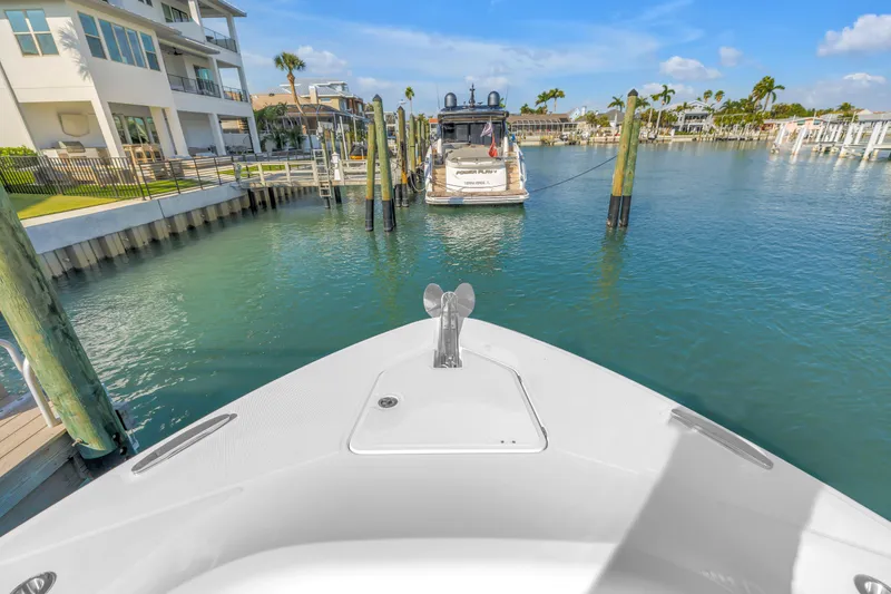 Slide: The Image of Bow view of 2023 HCB 53 Suenos RXV docked in a sunny marina. - 97