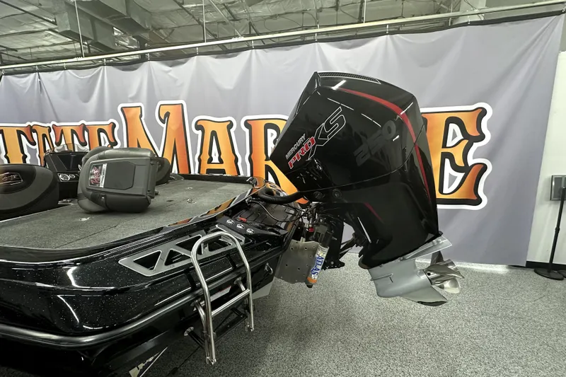 Slide: The Image of 2022 Ranger Z521L boat with Mercury Pro XS engine displayed indoors. - 11
