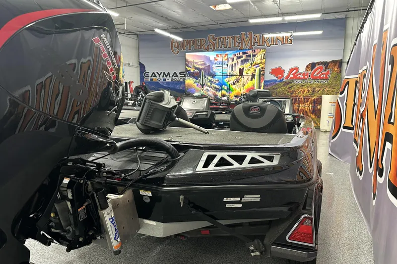 Slide: The Image of 2022 Ranger Z521L boat in showroom with vibrant marine-themed decor. - 12