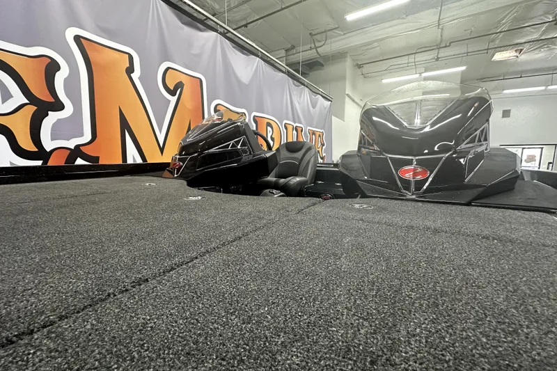 Slide: The Image of 2022 Ranger Z521L boat interior with sleek design and comfortable seating. - 13