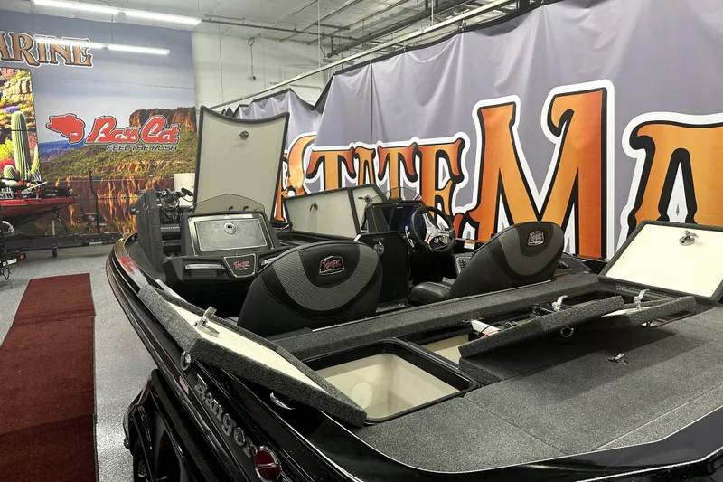 Slide: The Image of 2022 Ranger Z521L boat displayed indoors with open compartments. - 15