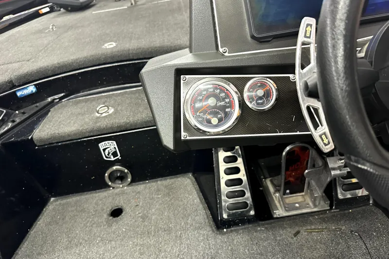 Slide: The Image of 2022 Ranger Z521L boat dashboard with gauges and steering wheel. - 16