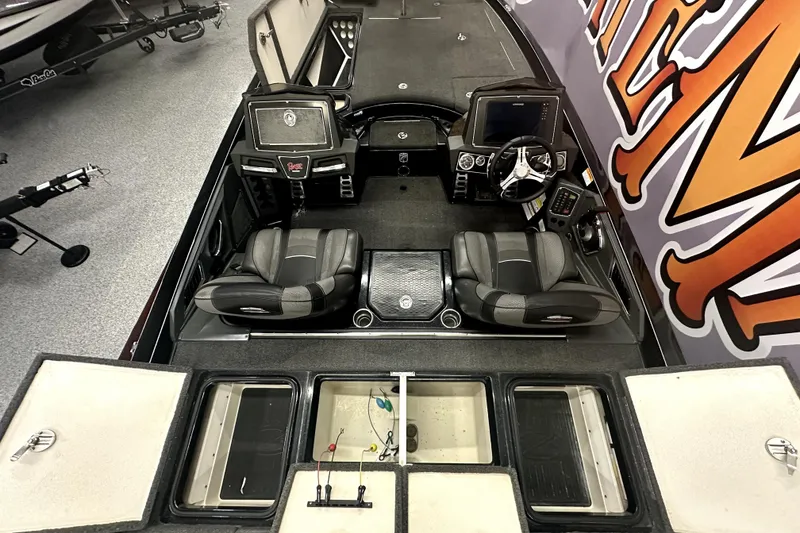 Slide: The Image of 2022 Ranger Z521L boat interior with dual seats and control panels. - 20