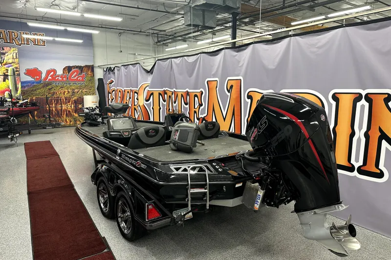 Slide: The Image of 2022 Ranger Z521L boat in showroom with powerful outboard motor. - 21