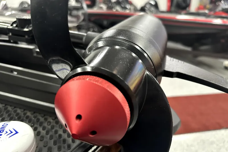 Slide: The Image of Close-up of 2022 Ranger Z521L boat motor with red cap and black propeller. - 26