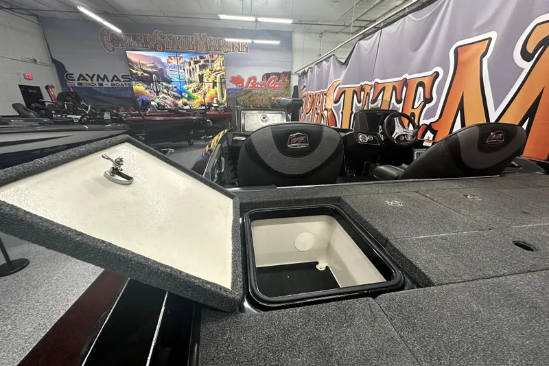 Slide: The Image of 2022 Ranger Z521L boat interior with open storage compartment in showroom. - 28