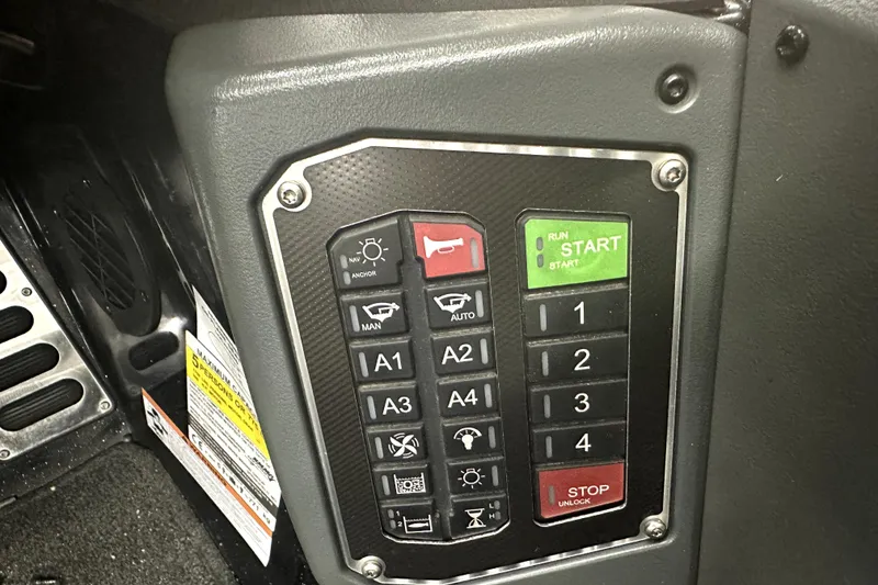 Slide: The Image of Control panel of a 2022 Ranger Z521L boat with various buttons and indicators. - 30