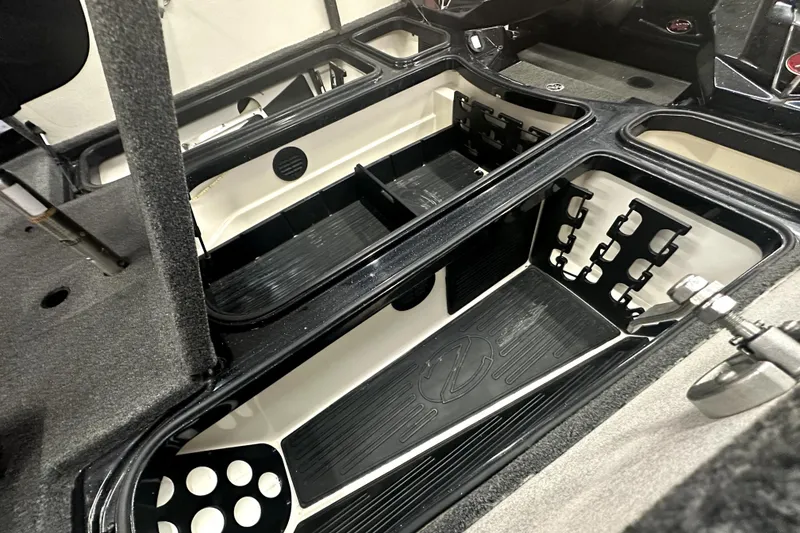 Slide: The Image of 2022 Ranger Z521L boat storage compartments with organized rod holders. - 37