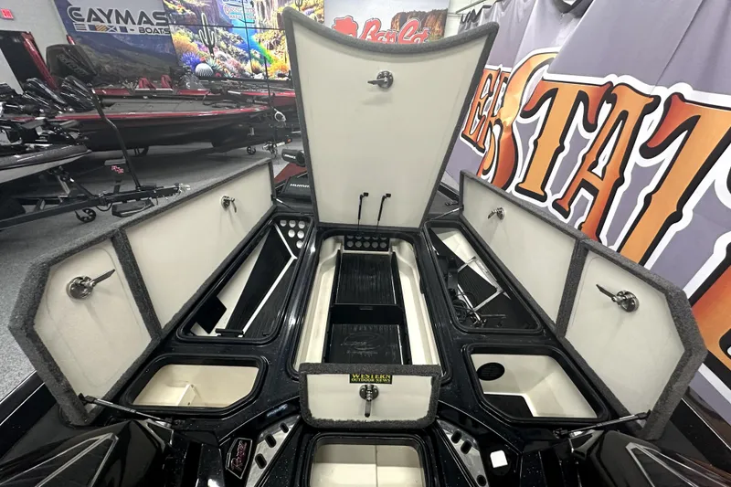 Slide: The Image of 2022 Ranger Z521L boat storage compartments open in showroom display. - 40