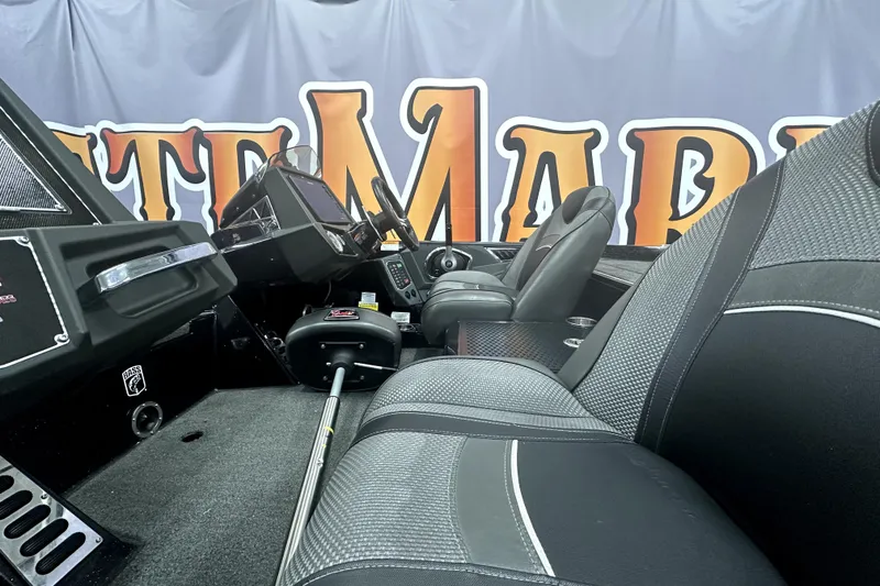 Slide: The Image of 2022 Ranger Z521L boat interior with sleek black seats and modern dashboard. - 43