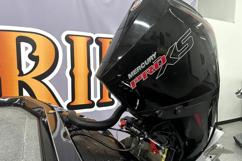 Slide: The Image of 2022 Ranger Z521L boat with Mercury Pro XS engine, displayed indoors. - 45