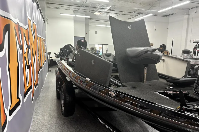 Slide: The Image of 2022 Ranger Z521L boat in showroom, featuring sleek design and comfortable seating. - 46