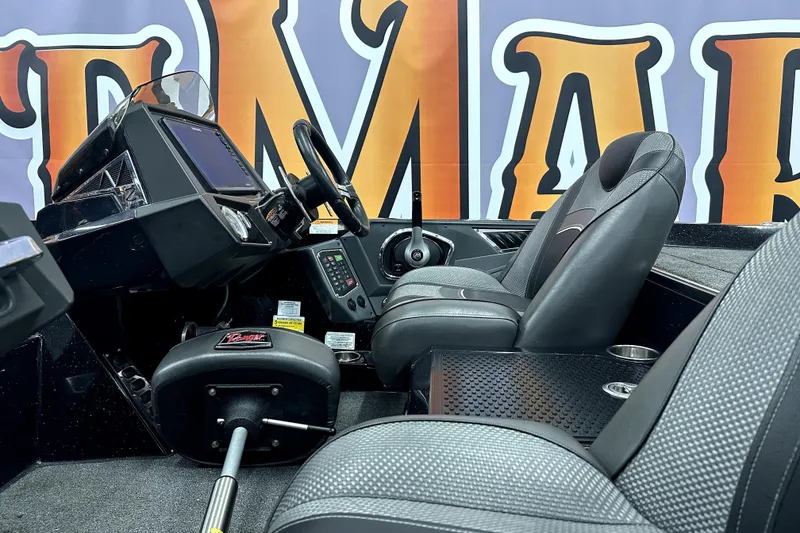 Slide: The Image of 2022 Ranger Z521L boat interior with steering console and seating. - 5