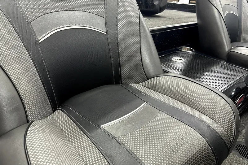 Slide: The Image of 2022 Ranger Z521L boat interior with textured black and gray seats. - 52