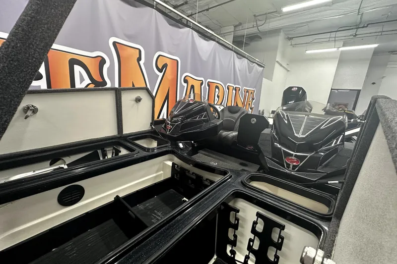 Slide: The Image of 2022 Ranger Z521L boat interior with storage compartments and sleek design. - 53