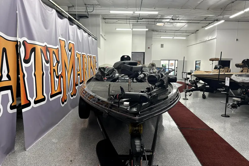 Slide: The Image of 2022 Ranger Z521L boat displayed in a showroom with marine equipment. - 55
