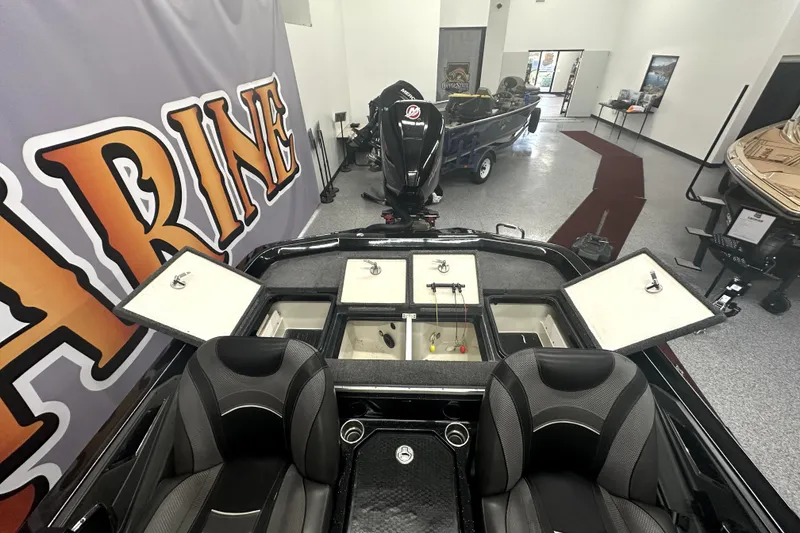 Slide: The Image of 2022 Ranger Z521L boat interior with open storage compartments in showroom. - 56