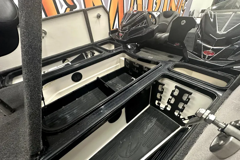 Slide: The Image of 2022 Ranger Z521L boat interior with open storage compartments and seating. - 61