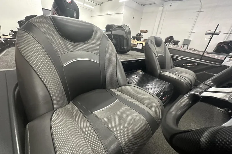 Slide: The Image of 2022 Ranger Z521L boat interior with sleek black and gray seats. - 63