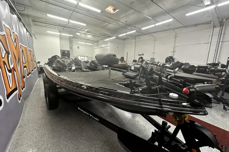 Slide: The Image of 2022 Ranger Z521L boat in showroom, featuring sleek design and advanced equipment. - 64