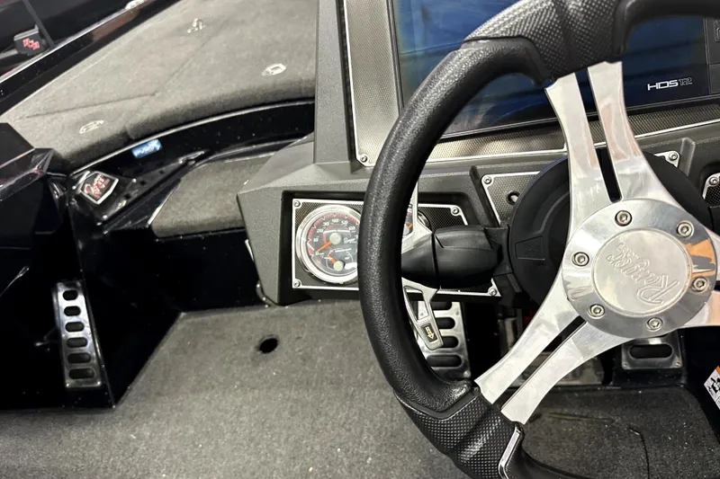 Slide: The Image of 2022 Ranger Z521L boat dashboard with steering wheel and gauges. - 69