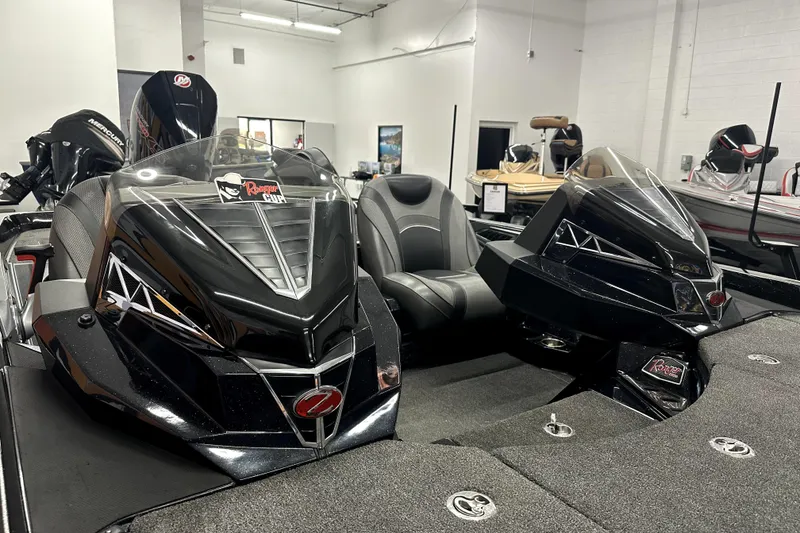 Slide: The Image of 2022 Ranger Z521L boat interior with dual consoles in showroom. - 71