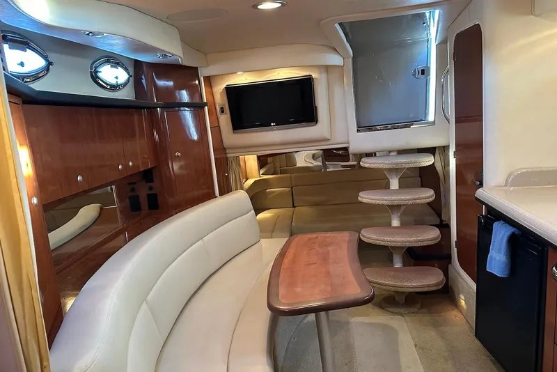 Slide: The Image of Luxurious interior of 2006 Sea Ray 340 Sundancer yacht with elegant seating and modern amenities. - 14