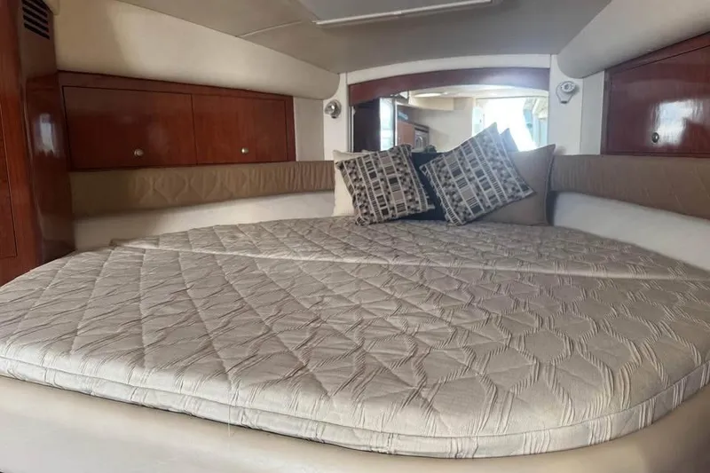 Slide: The Image of 2006 Sea Ray 340 Sundancer boat interior with lake view and comfortable seating. - 7