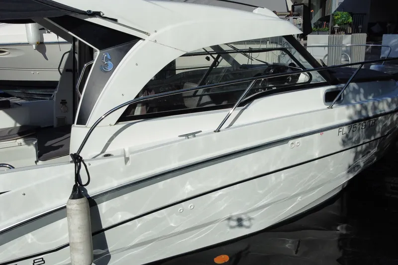 Slide: The Image of 2022 Beneteau Antares 8 boat docked, showcasing sleek design and modern features. - 11