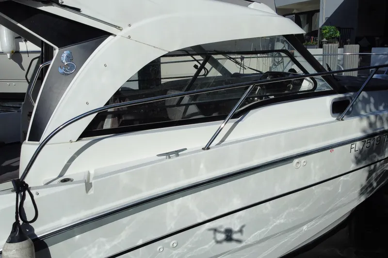 Slide: The Image of 2022 Beneteau Antares 8 boat docked, showcasing sleek design and modern features. - 12