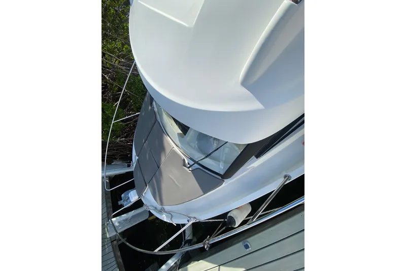 Slide: The Image of Overhead view of 2022 Beneteau Antares 8 boat docked at a marina. - 20