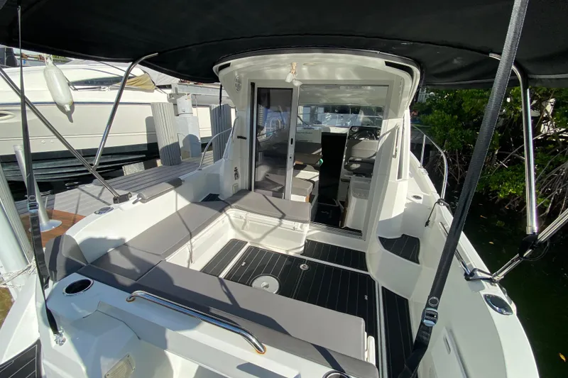 Slide: The Image of Beneteau Antares 8, 2022 model, featuring spacious deck and modern interior design. - 23