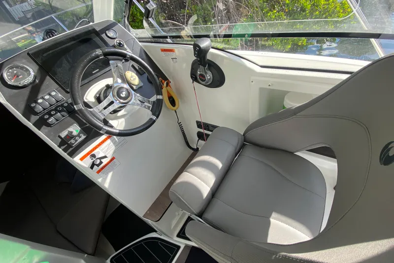 Slide: The Image of Cockpit of 2022 Beneteau Antares 8 with steering wheel and control panel. - 27