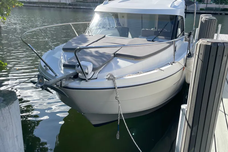 Slide: The Image of 2022 Beneteau Antares 8 boat docked at marina, side view. - 3