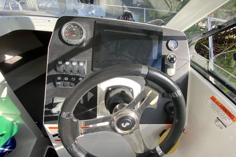 Slide: The Image of Steering console of 2022 Beneteau Antares 8 boat with gauges and controls. - 33