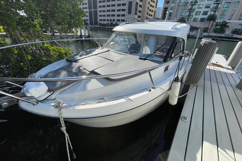 Slide: The Image of 2022 Beneteau Antares 8 boat docked in marina, front view. - 4