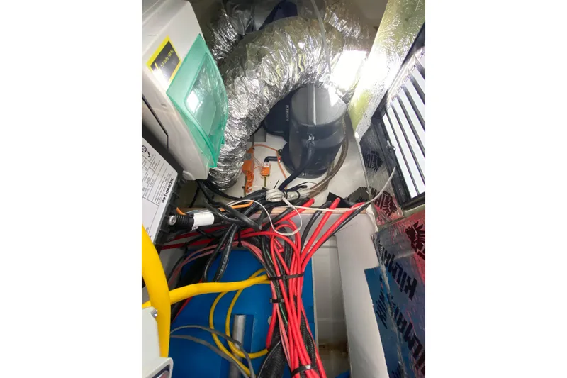 Slide: The Image of Engine compartment of 2022 Beneteau Antares 8 with wiring and ventilation ducts. - 40