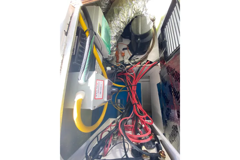 Slide: The Image of Electrical wiring and components inside a 2022 Beneteau Antares 8 boat. - 41