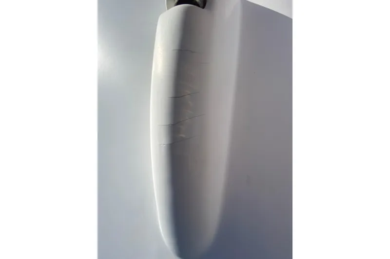 Slide: The Image of Close-up of a 2022 Beneteau Antares 8 hull with visible surface cracks. - 44